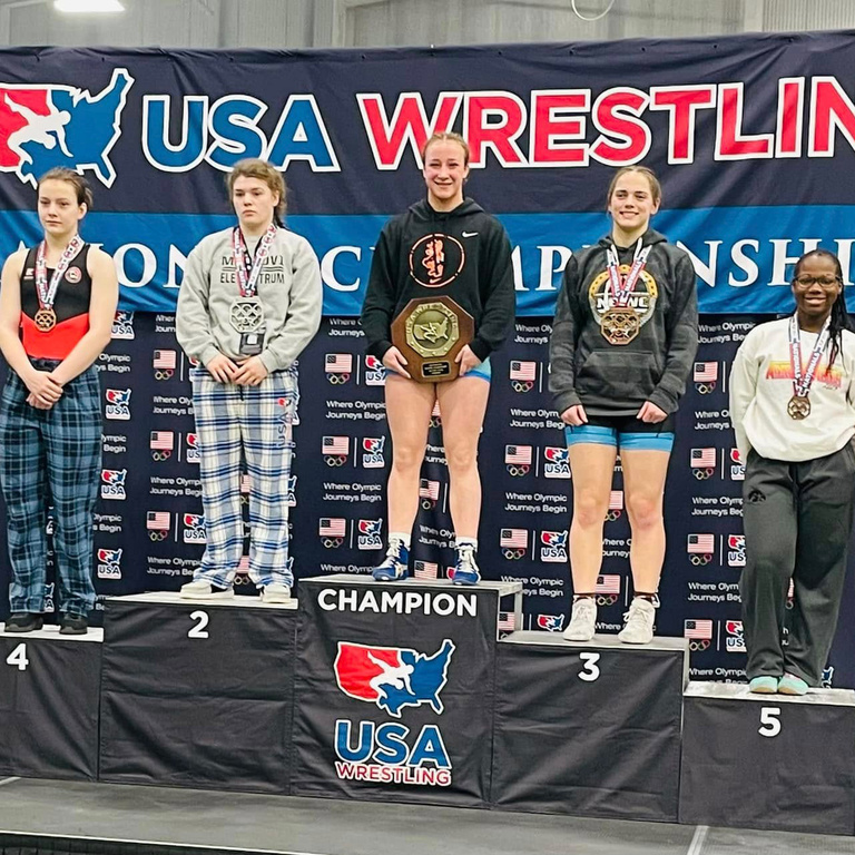 Eve Skrocki atop a podium at nationals