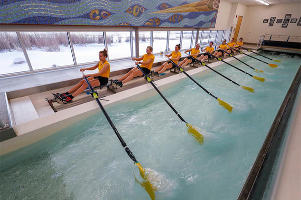 women rowing in the beckwith boathouse