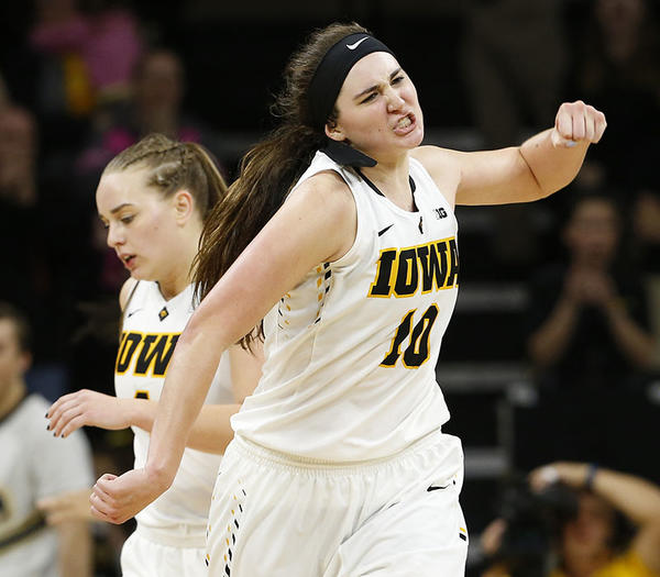 university of iowa women's basketball player Megan Gustafson pumps her fist in celebration on the court