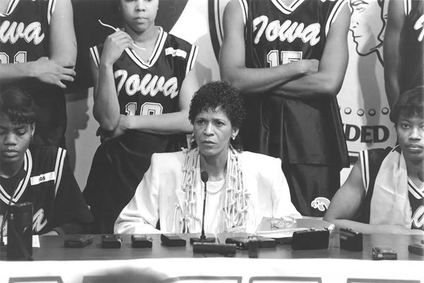 University of Iowa women's basketball coach C. Vivian Stringer with her players at a press conferene