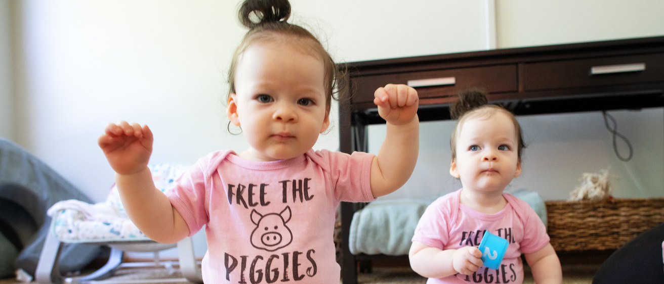 two young siblings playing at home