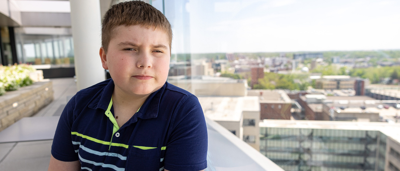 A boy sitting near a window