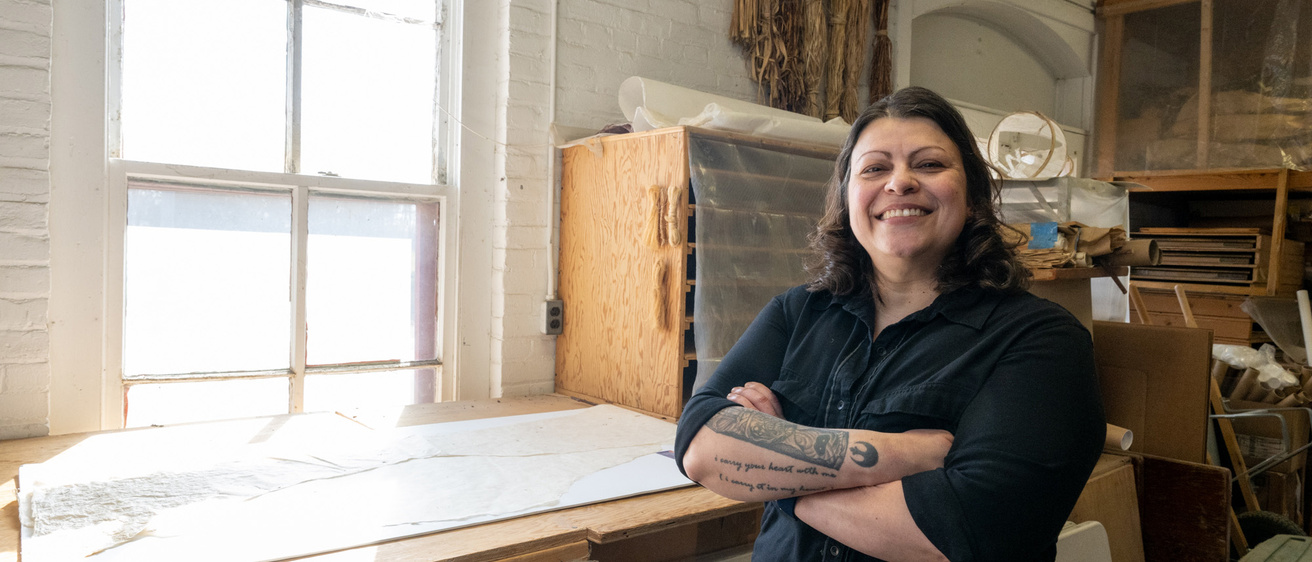 A woman standing in an art studio