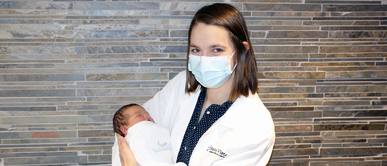Liz Dupic holding a baby