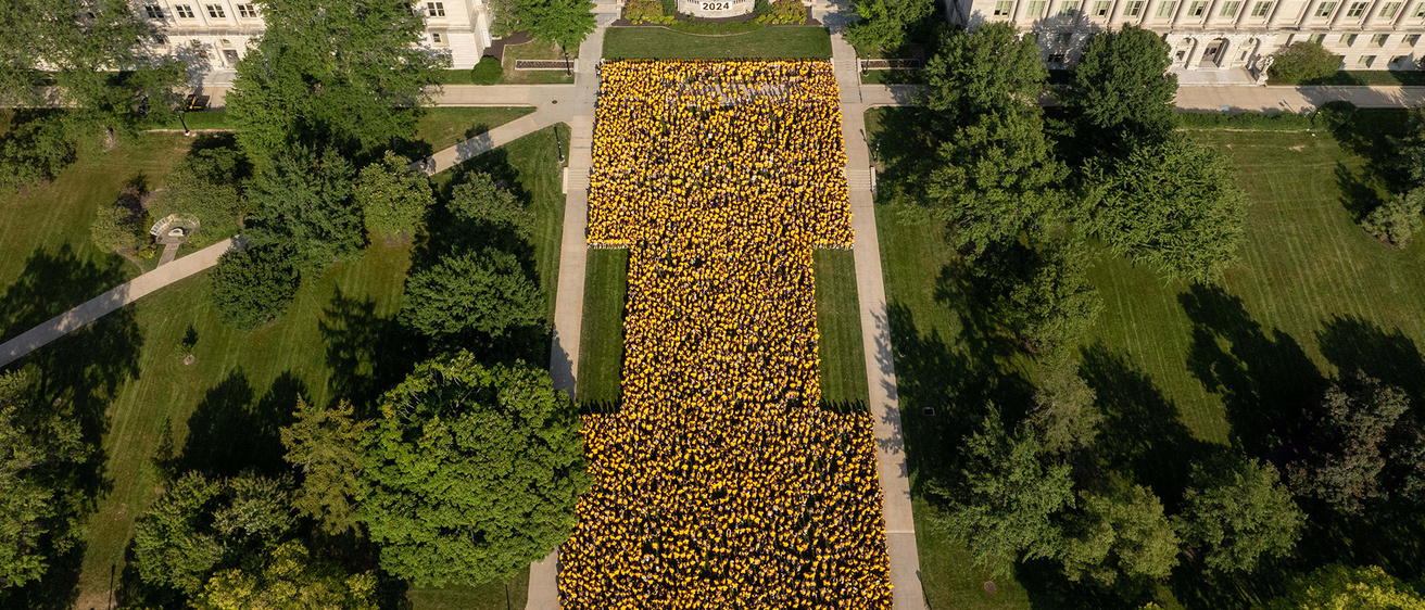 students forming a Block I on the Pentacrest lawn