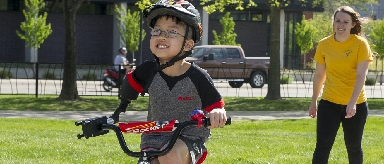 A young child riding a bicycle