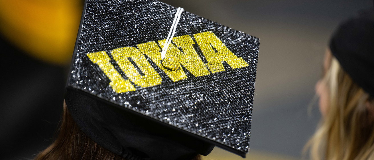 a bedazzled graduation cap with the Iowa logo