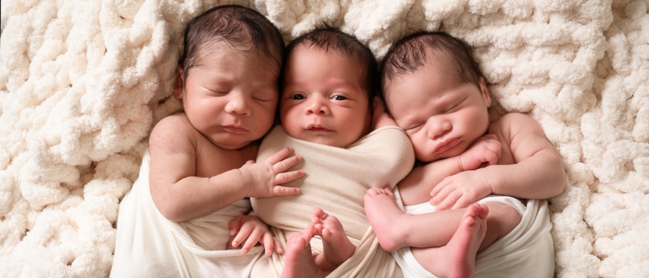 the Pinckney triplets lying together on a blanket