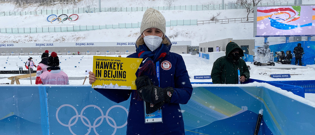 University of Iowa alumna Sarah Wilhelmi posing outdoors at the 2022 Winter Olympics in Beijing