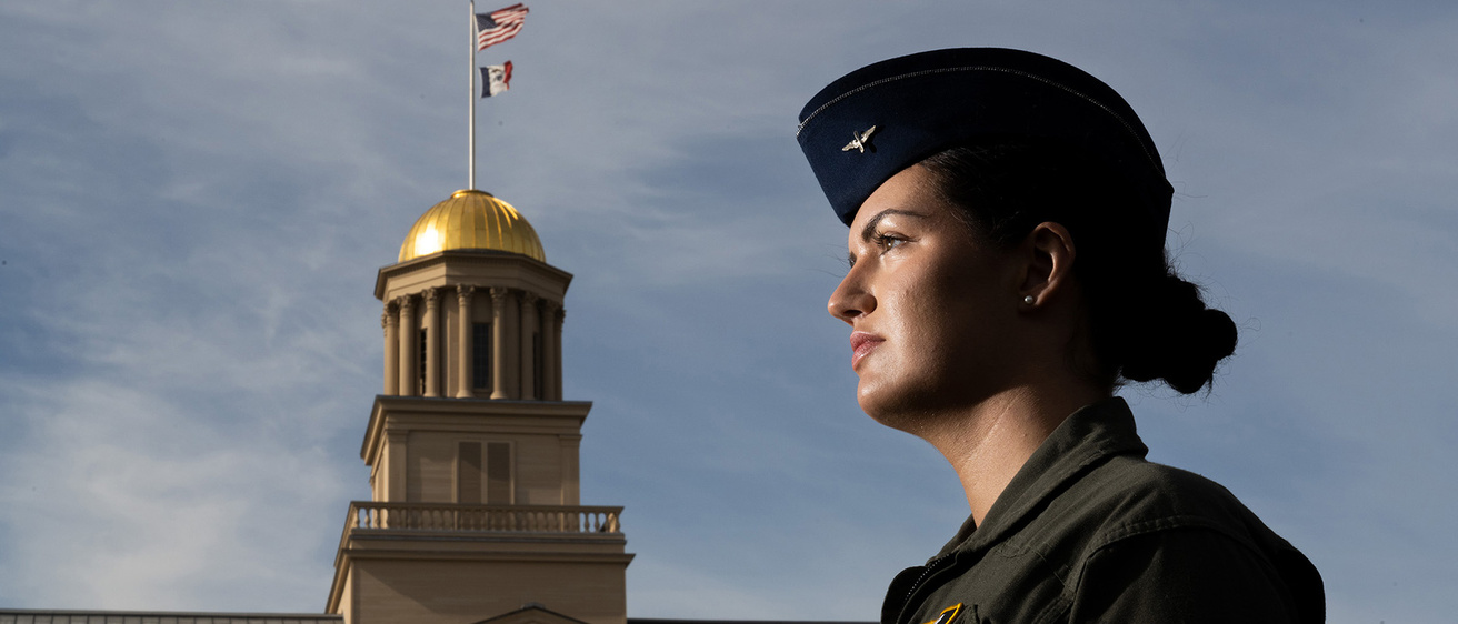Abbie Moore in military uniform standing before Old Capitol