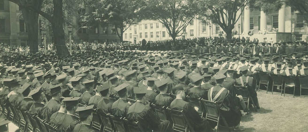 a commencement ceremony on the university of iowa campus in the 1910s