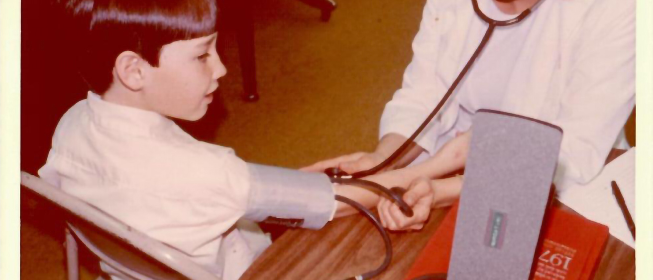 A doctor taking someones vital signs