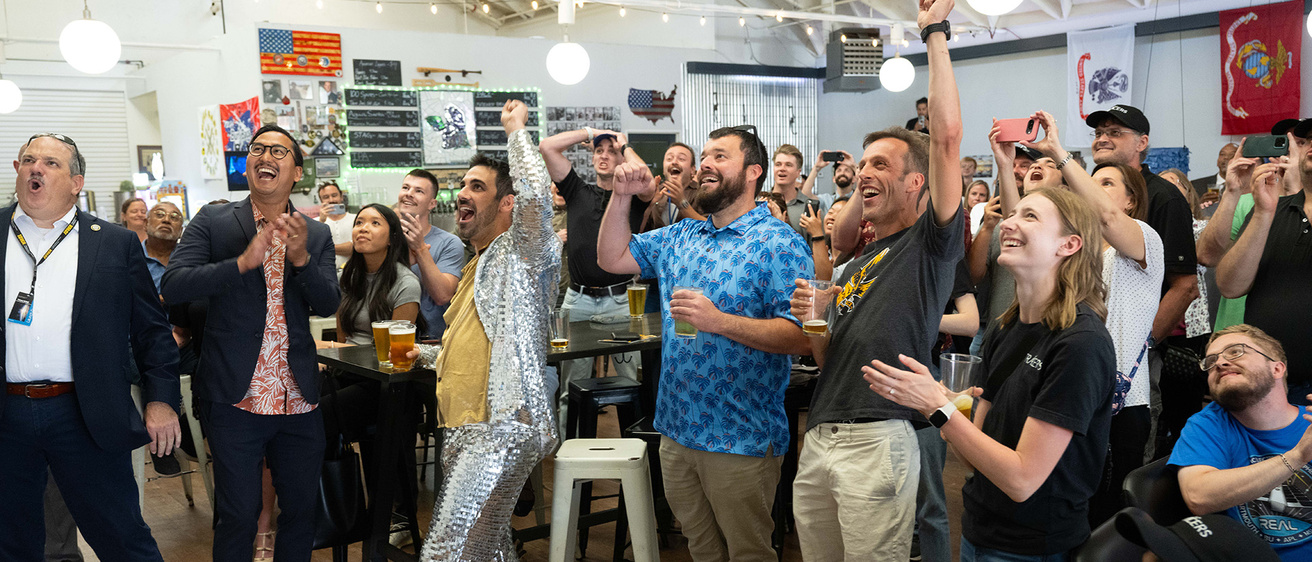 University of Iowa TRACERS team members celebrate the launch of the Falcon 9 rocket