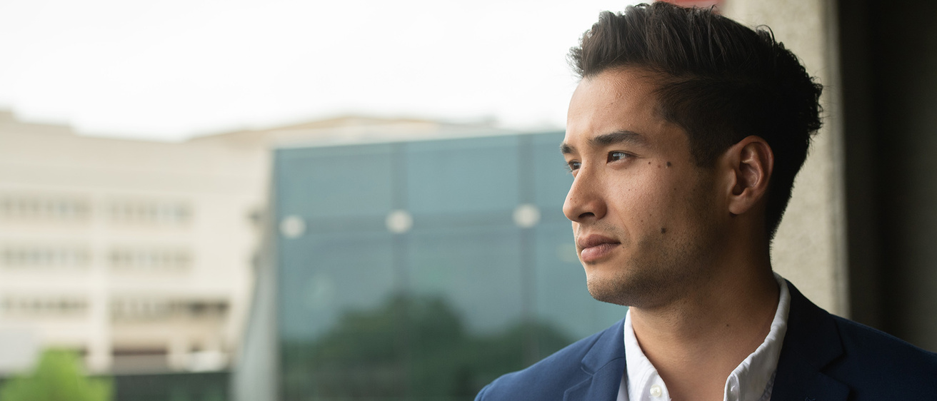 a man standing on the university of iowa campus