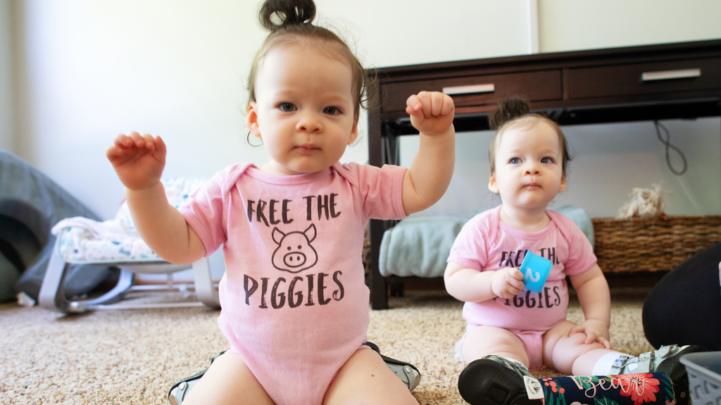 two young siblings playing at home