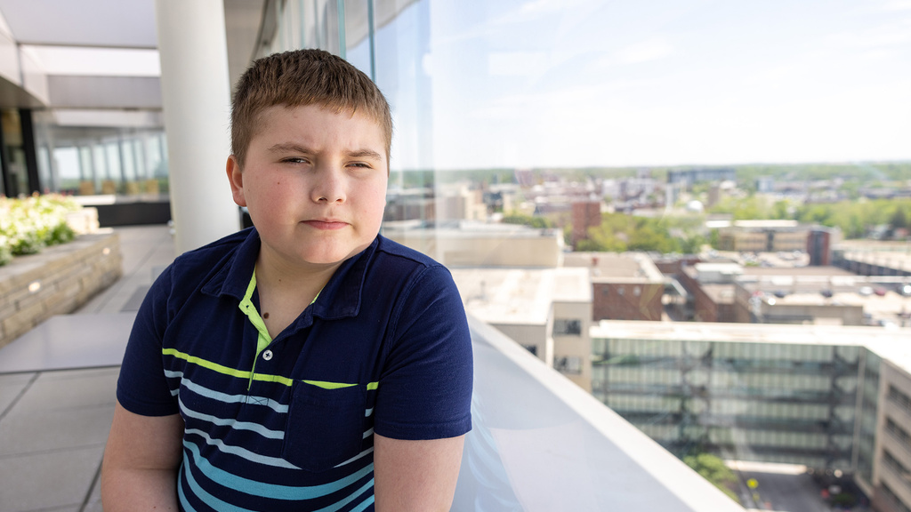 A boy sitting near a window