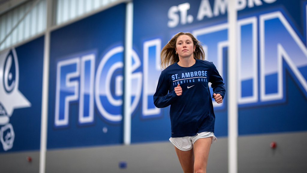 A girl running in a stadium