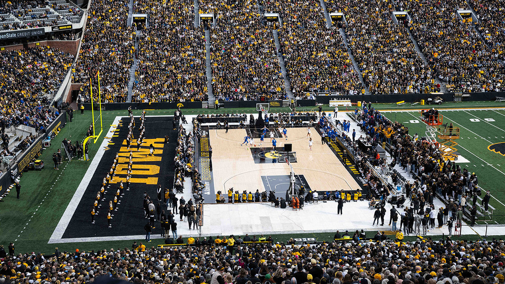 a women's basketball game played outdoors at Kinnick Stadium