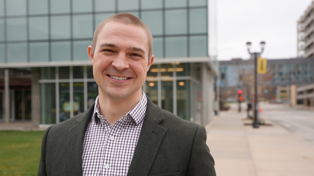 A man standing outside smiling