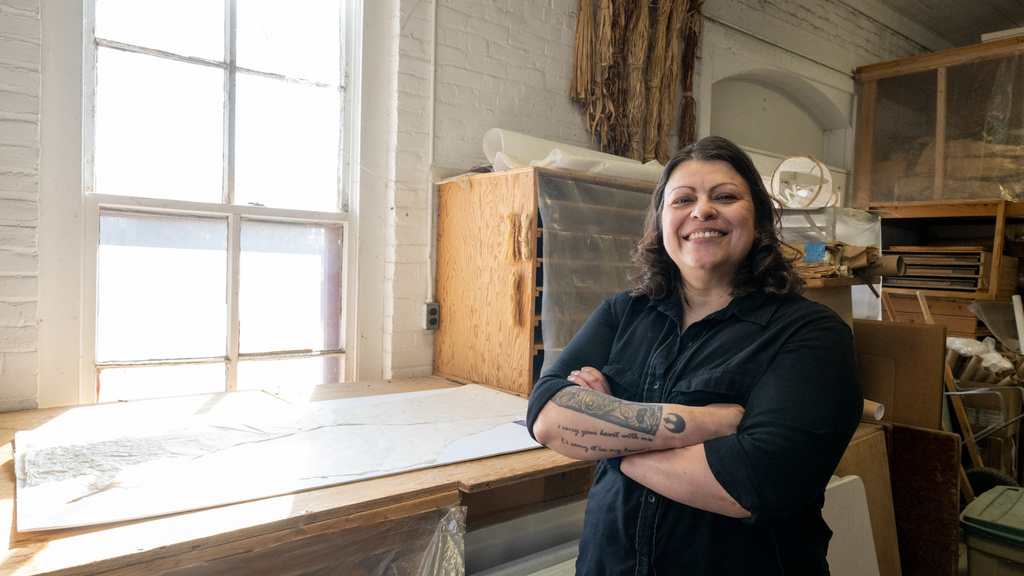 A woman standing in an art studio
