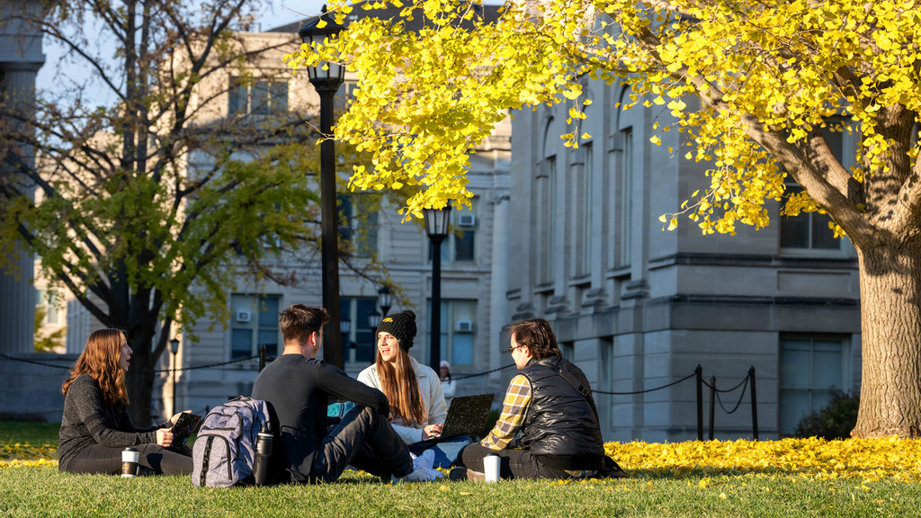 students gathered outdoors on the university of iowa campus