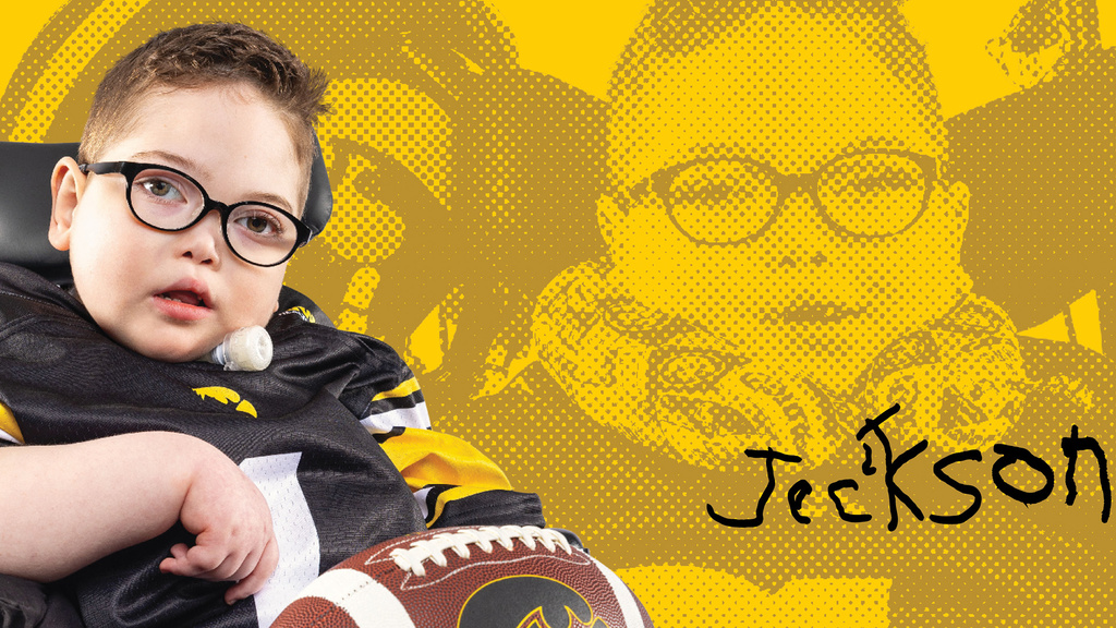 A photo of a young boy with a football