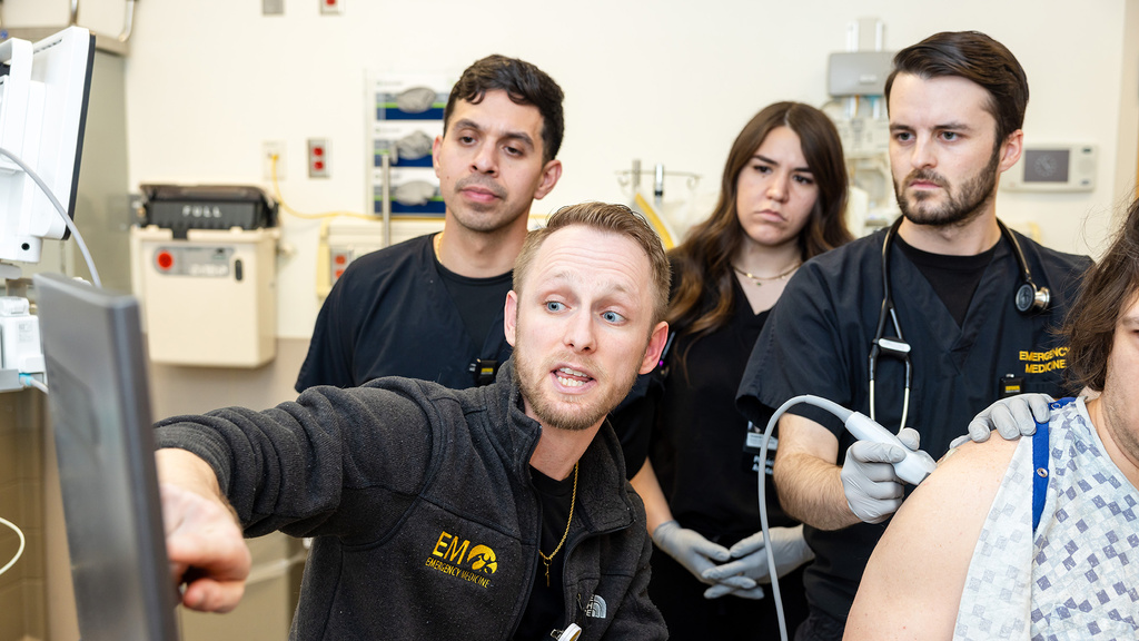 Emergency medicine physician assistant residents with simulated patient and Christian Junker, PA-C