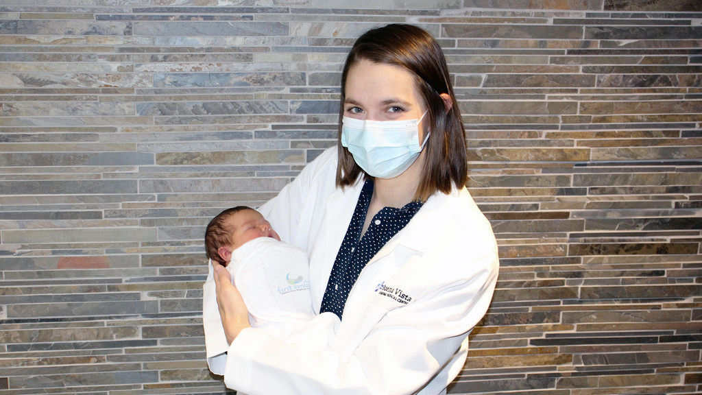 Liz Dupic holding a baby