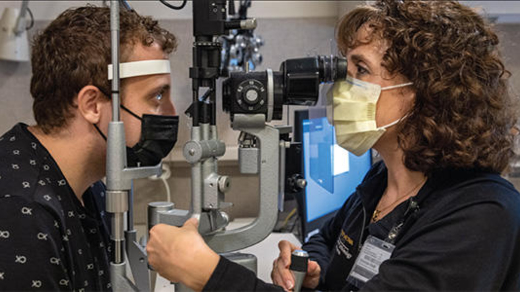 A doctor giving an eye exam