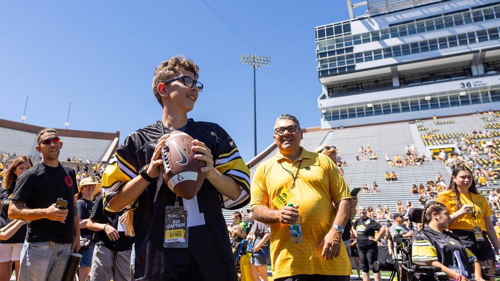 A boy holding a football
