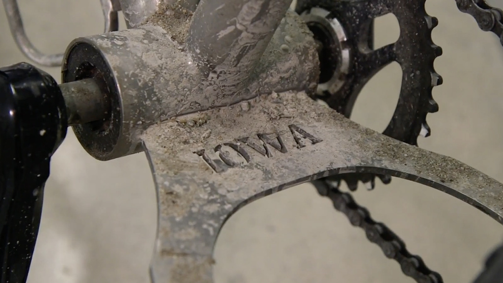 A partof a bike with Iowa engraved in it