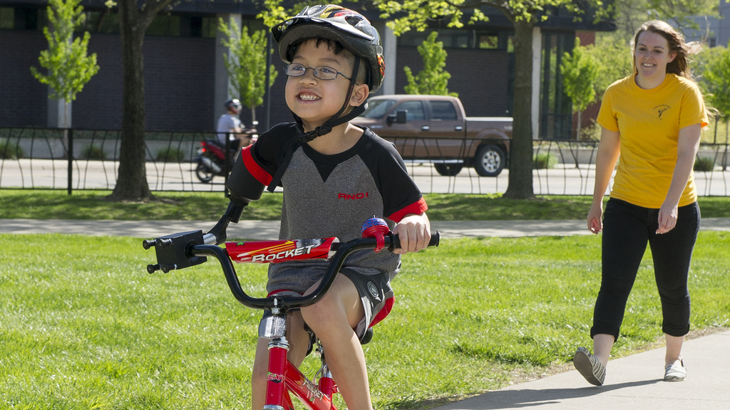 A young child riding a bicycle