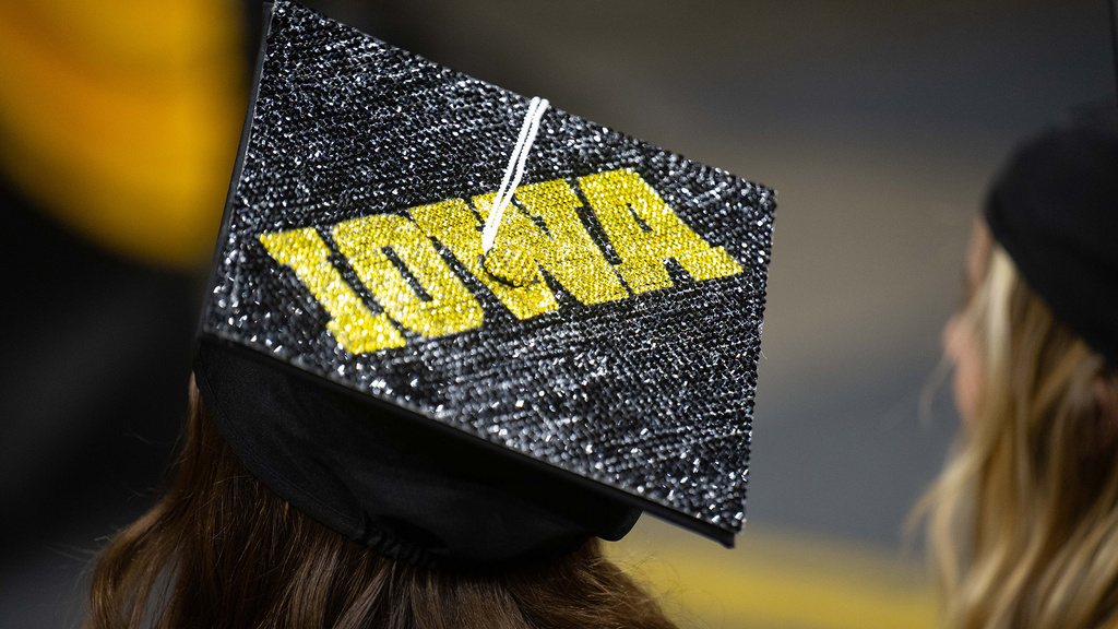 a bedazzled graduation cap with the Iowa logo