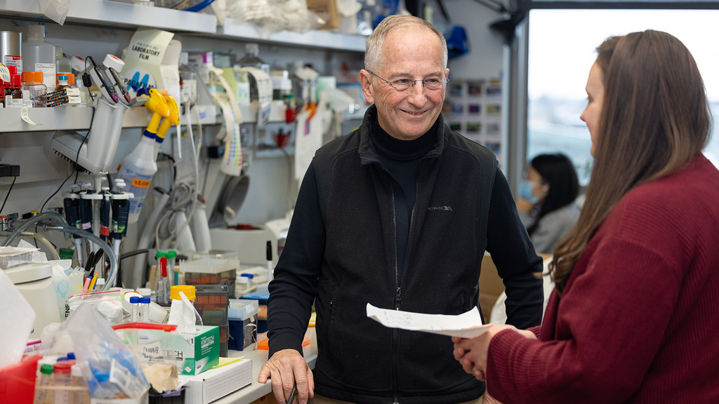 two people talking in a lab