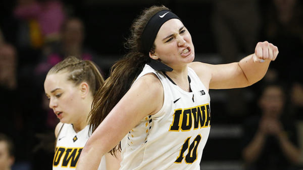 university of iowa women's basketball player Megan Gustafson pumps her fist in celebration on the court