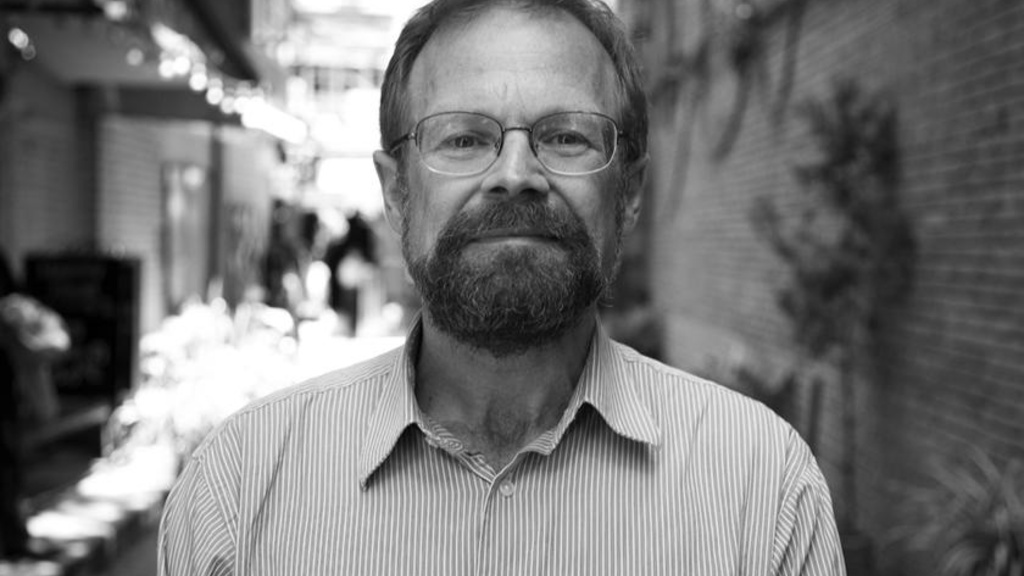 A man standing in an alley 