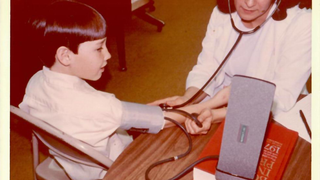 A doctor taking someones vital signs