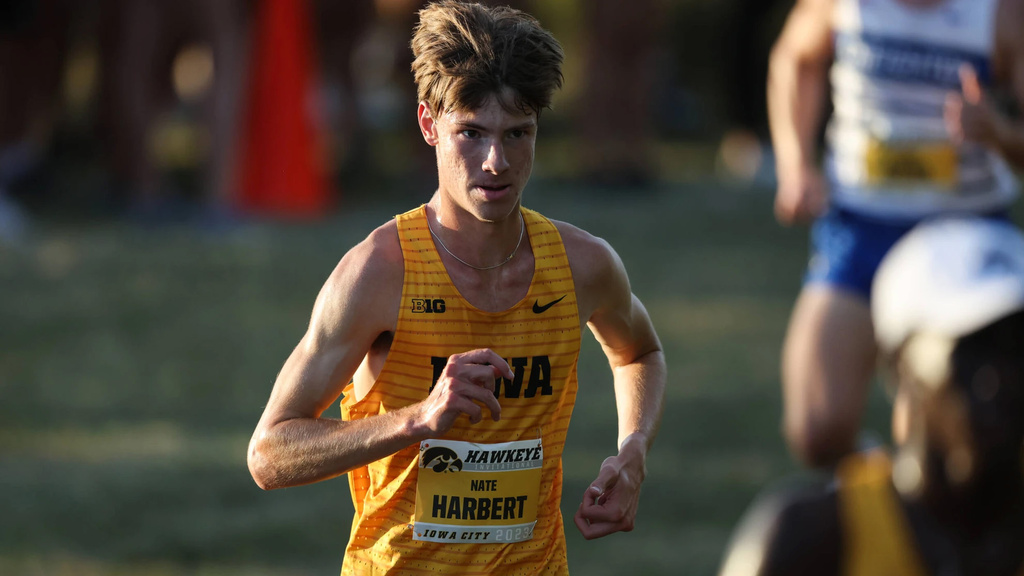 an Iowa cross-country runner competing in a meet