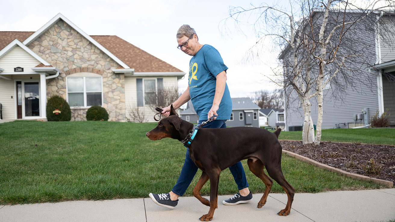 a woman taking her dog for a walk