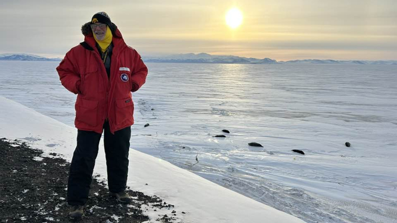 A an standing on a frozen shore