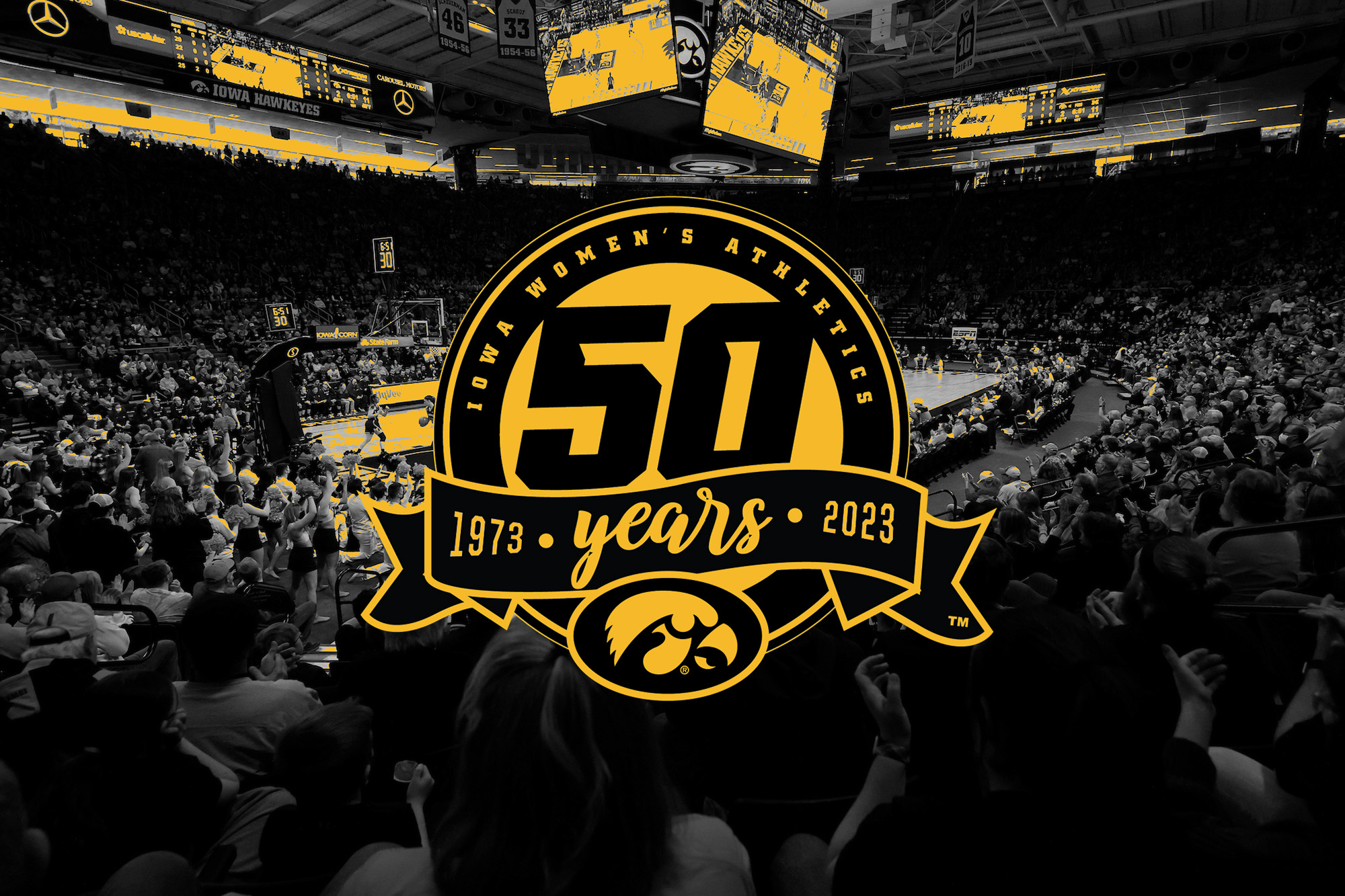 photo of carver-hawkeye arena with a logo marking 50 years of women's athletics at the university of iowa